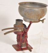 An early 20th century cast iron vintage Industrial creamer. Complete with bowl, the wratchet