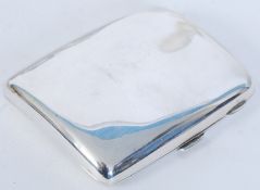 A John Millward Banks hallmarked silver cigarette case dating to 1904. Of simple form with plain