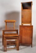 Two 1930's oak bedside cabinets, an oak nest of tables together with a small stool and a side table