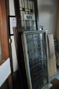 A mid 20th century stained glass salon door together with large stained glass windows being leaded