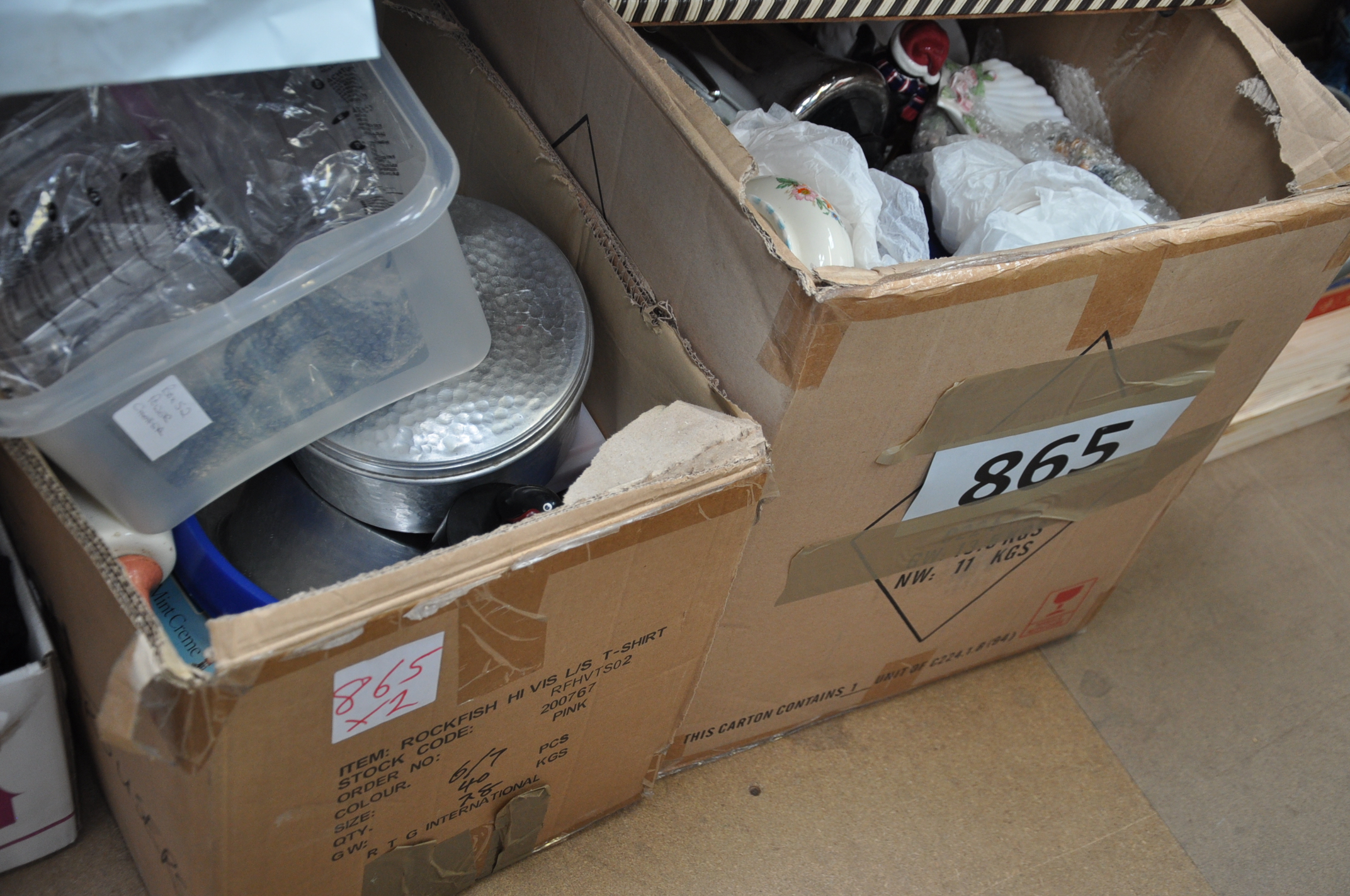Two boxes of assorted china and kitchen wares.