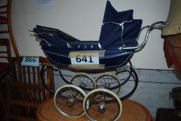 A twin hooded vintage Silvercross childs pushchair / pram.