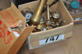 A box of brass and copper wares including jugs, Georgian style candelabra, clock, dagger and other