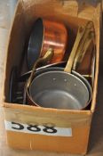 A box of vintage copper and brass saucepans etc