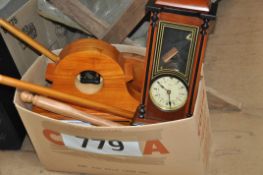 A box of bathroom accessories along with two clocks