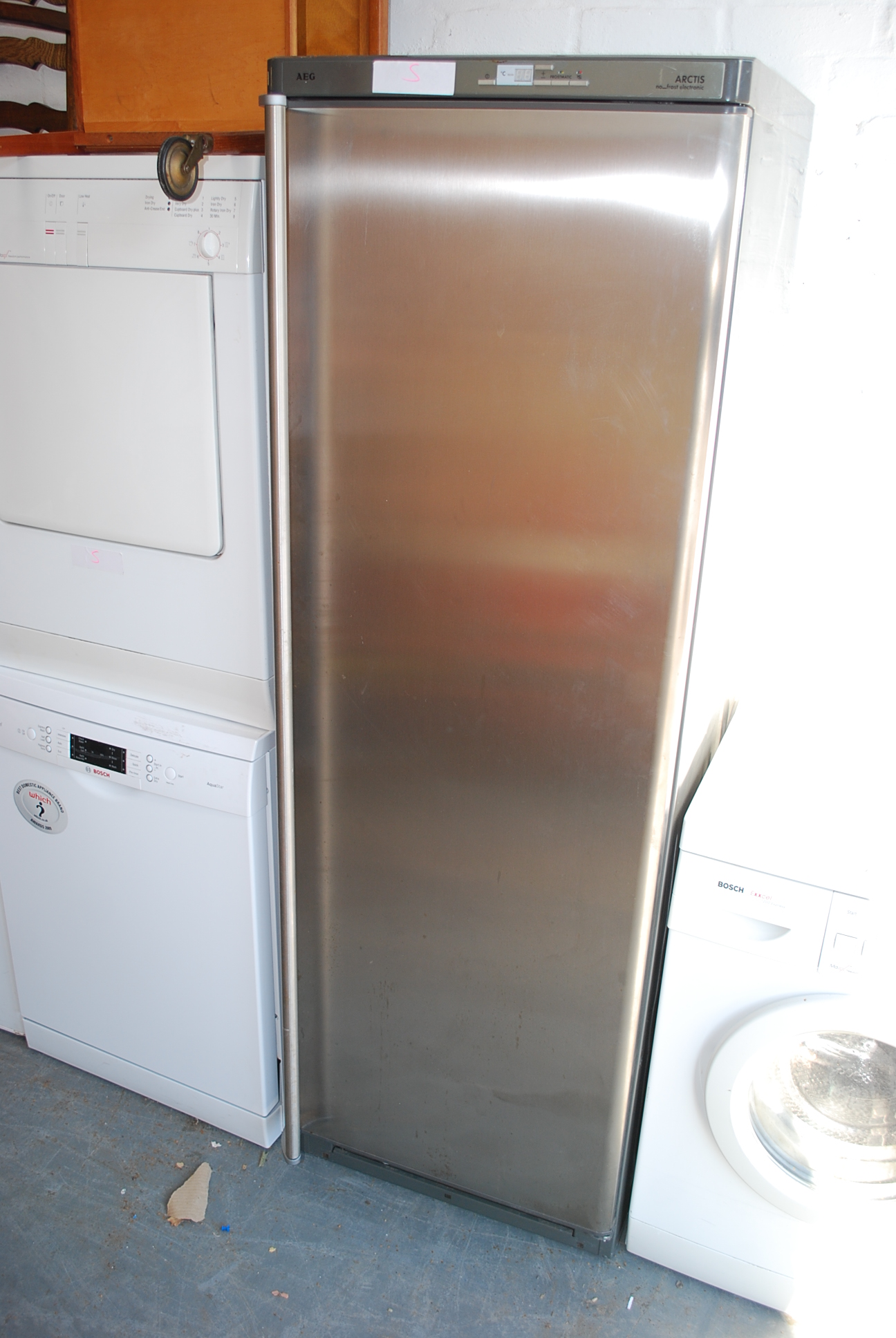 A tall AEG arctis  ( no frost electronic ) fridge with fitted interior in stainless steel finish