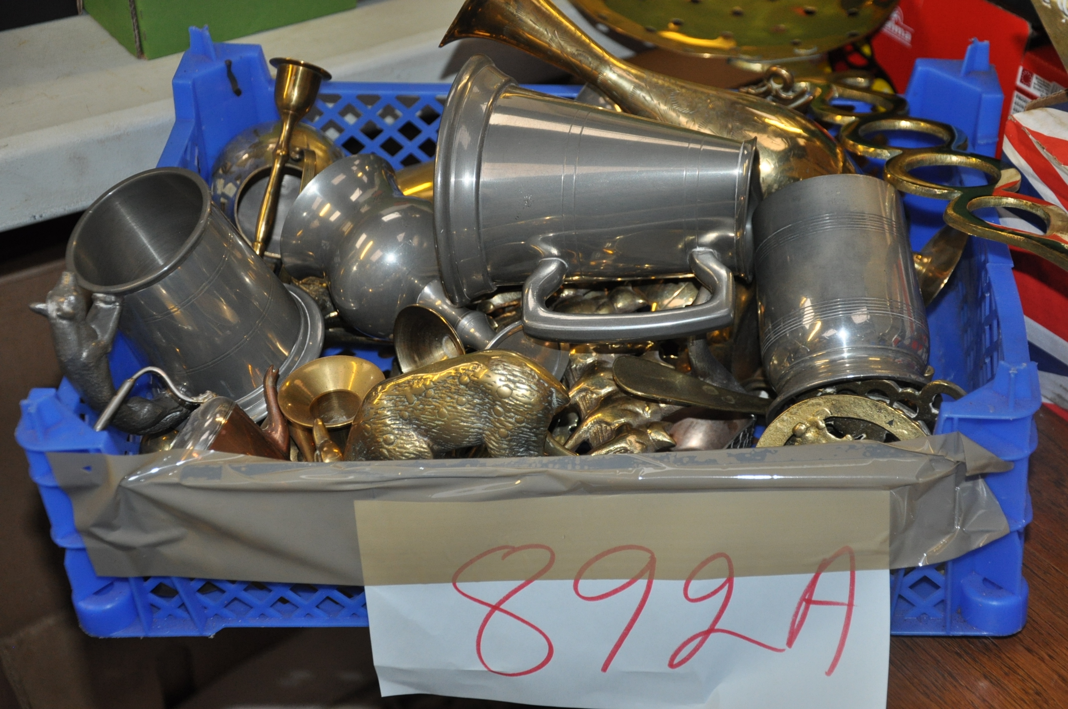 A mixed lot to include a brass inkwell, horse brasses, candlesticks, brass ducks and items of Pewter