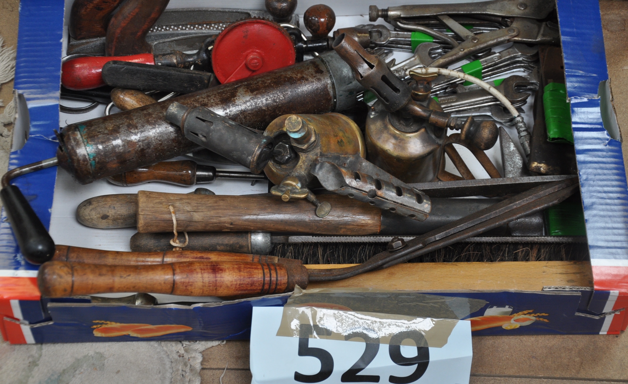 A good selection of vintage tools to include spanners, molegrips, grease gun, vintage brass blow