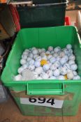 A large quantity of golf driving range / golf balls.