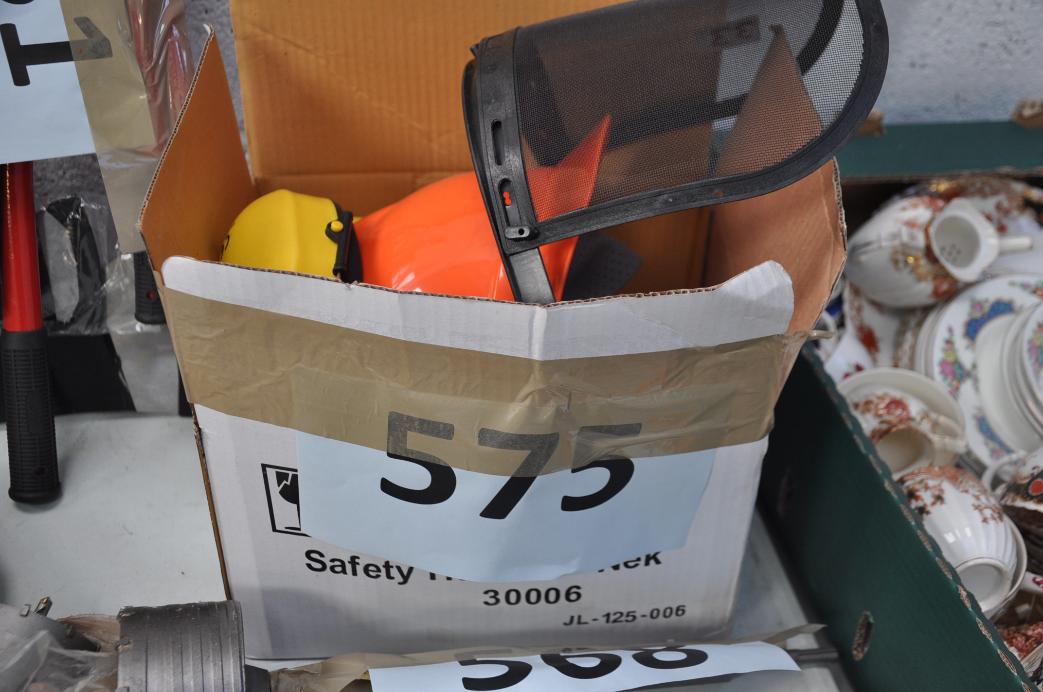 A new chainsaw workmans helmet and ear defenders.