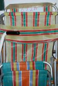 A collection of vintage retro multicoloured folding sun lounger / beach chairs