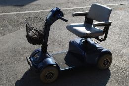 A  Pride Victory Economy motability scooter complete with charger and basket, instruction manual etc