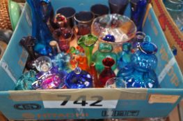 A box of mixed glassware to include paperweight, drinking glasses and other items.