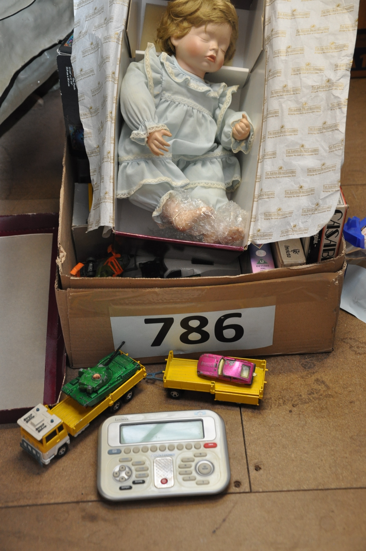 A box of retro  / vintage gamesalong with Dinkies, Matchbox etc