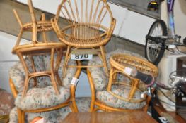 A seven piece wicker conservatory set comprising settee, chairs and 3 tables.
