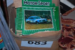 A box of vintage Motorsport car magazines.