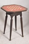 A late Victorian oak enamel top chess board tavern table. Square tapered legs with shaped frieze