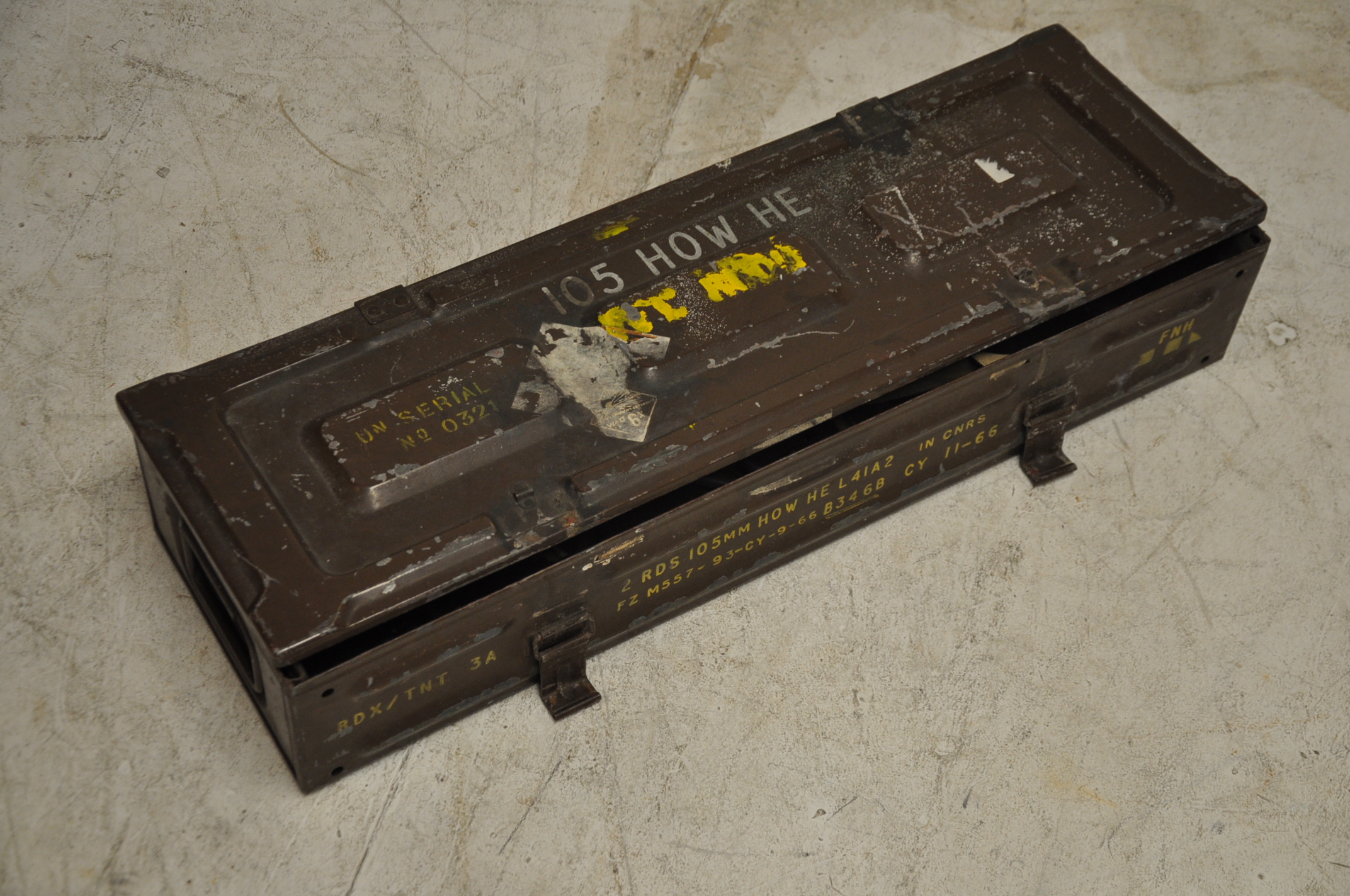 A military metal ammo box with a small quantity of vintage tools