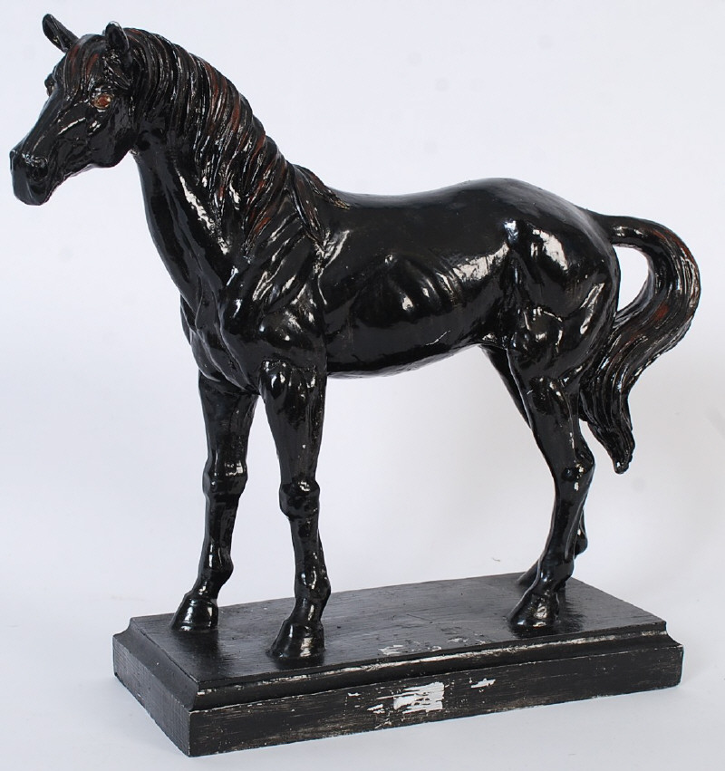 A composite metal sculpted figure of a horse on plinth base. 34cms High x 40cms Wide