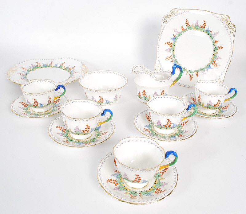 A Kirby New Chelsea Staffordshire china part tea set, being boldly hand painted with rainbow