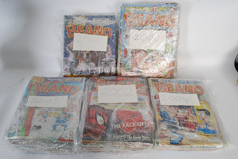 A large collection of beano comics from 2001 to 2004 in new condition complete with the sweets /