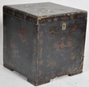 A 19th century Japanese black laquer chinoserie painted casket with notation to front, hinged lid
