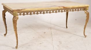 An onyx and brass gilt painted coffee table. H45cm x W100cm x D50cm