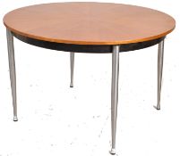 A 1970's Merrow Associates Robert Young style teak and chrome dining table. The turned tapering