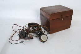A vintage Cosmos crystal set radio with the original headphones together with spares etc