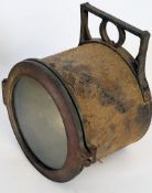 An Edwardian large copper and cast iron ships spot light having a cylindrical body with door to
