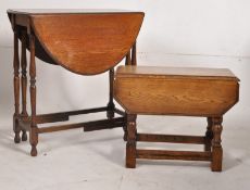 A small oak drop leaf coffin table together with a drop leaf dining table raised on turned supports.