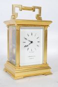 A modern gilt brass carriage clock, with a platform lever escapement and striking on a bell, the