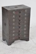 An Arts & Crafts style apprentice piece chest of drawers. Heavily embellished with white metal