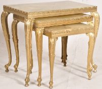 An onyx and brass gilt painted nest of tables. H44cm x W51cm D30cm.