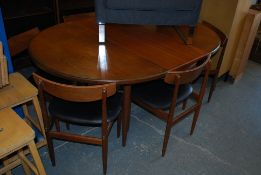 An original 1970's G-Plan large teak wood extending dining table. The turned and tapered legs having