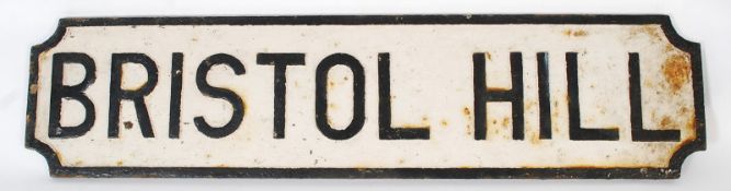 An original cast iron road sign from the city of Bristol. Black border with 'Bristol Hill' to