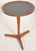 An original Danish teak wine or lamp table by Hans C Andersen of circular form with an ebonised