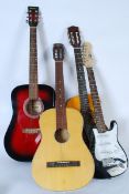 A cased 3/4 size students electric guitar complete with case along with 3 other guitars all with
