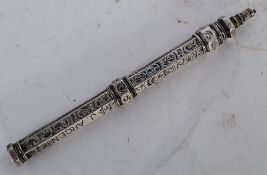 A good Victorian silver rococo propelling pencil by J Mordan & Co. Rococo chased design with