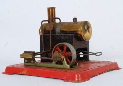 A Mamod stationary engine model complete with tinder box mounted on metal plinth