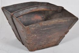 A vintage carrying trug with metal framed support