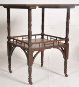 After E.W. Godwin, An Edwardian mahogany occasional table having a spindle gallery undertier all