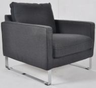 An Ikea Mellby Dansbro dark grey chrome and fabric armchair in the retro / mondernist style  bearing