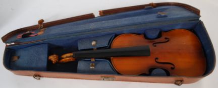Two vintage cased violins, one being Chinese made the other unmarked. Both in cases, and one with