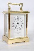 A large 20th century Taylor & Bligh brass cased carriage clock. Having five windows with  white