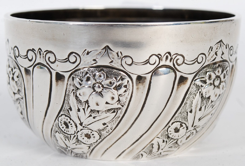 A Victorian Mappin Brothers silver bowl of rococo form being hallmarked for Chester 1896. 63gms