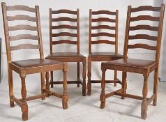 4 x 1930's oak ladderback dining chairs, turned legs, united by stretchers, drop in seat with ladder