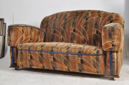 A pair of 1930's Art Deco cloud back 2 seat sofa settee complete in the original fabric. Measures