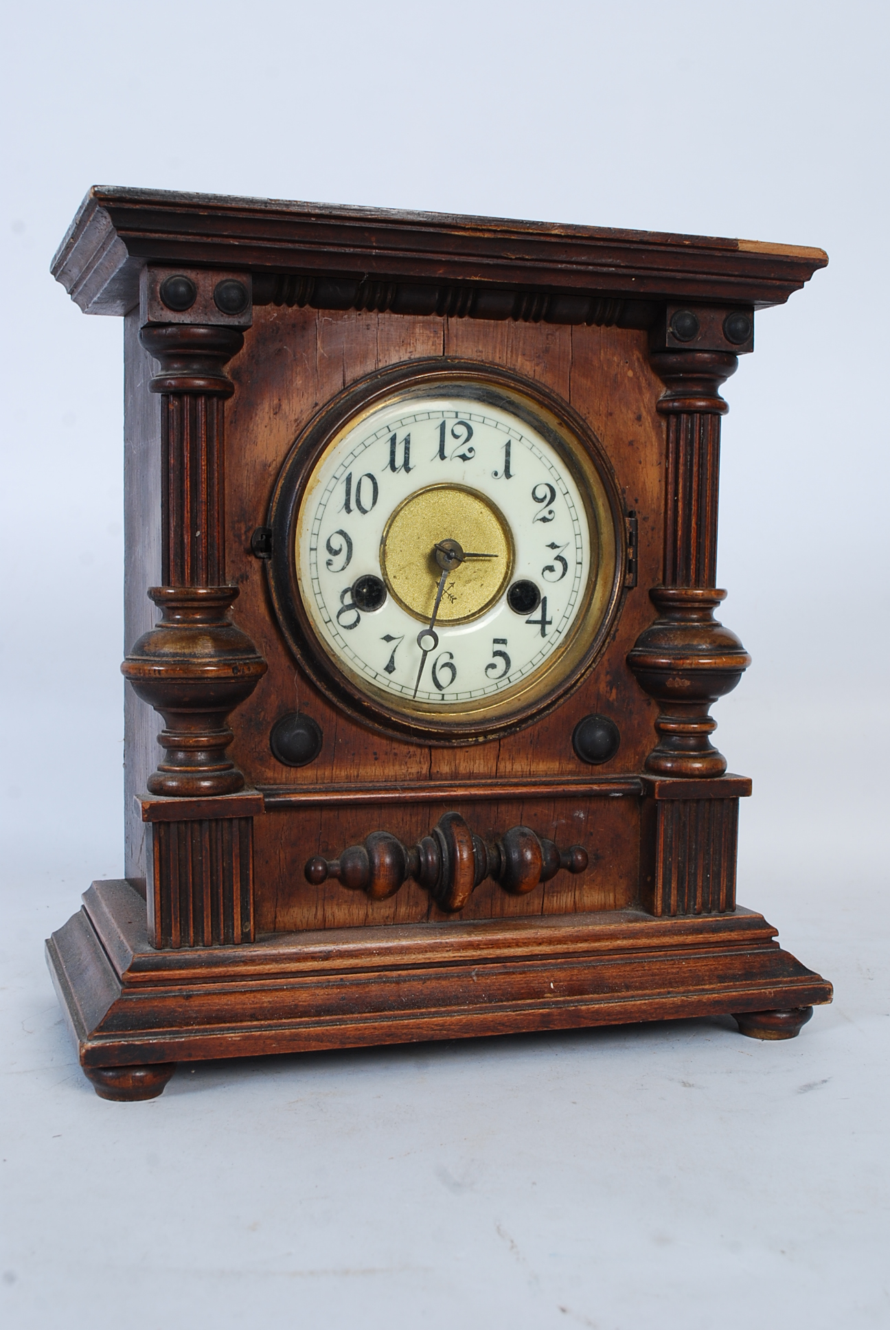 A Hamburg America Company HAC mantle clock set within a mahogany case having columns to sides. The 8