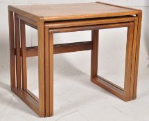 A retro 1970's G-Plan teak wood nest of tables in the Quadrille pattern. The graduating tables